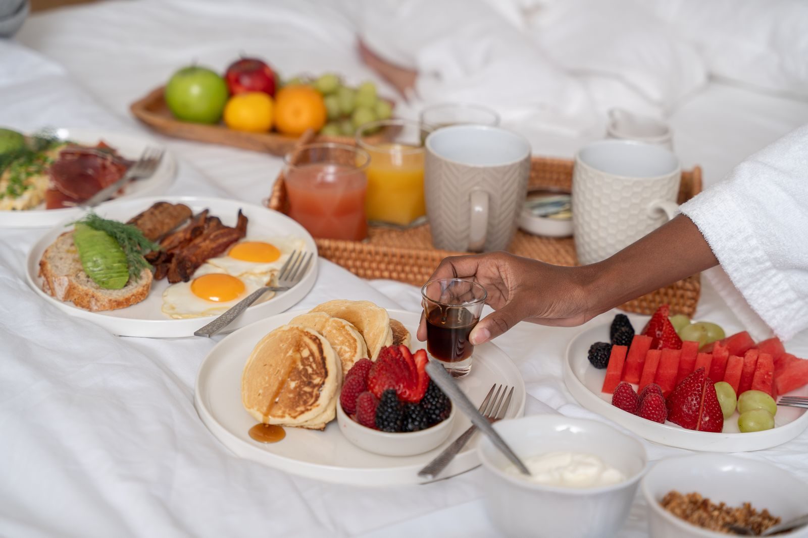 Breakfast spread with fruit, pancakes and fresh juice served by the chef